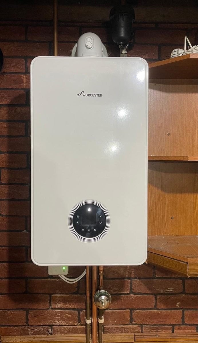 Worcester Greenstar boiler installed on an exposed red brick wall
